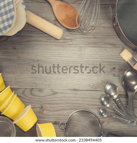 Various baking tools arrange from overhead view on wooden table in vintage tone. Copy space on middle with square composition.