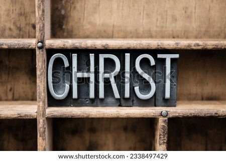 The word -CHRIST- written in vintage metal letterpress type in a wooden drawer with dividers.