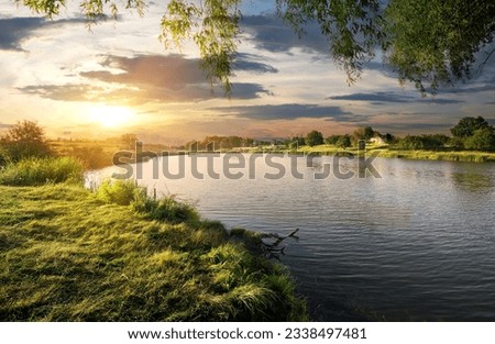 Beautiful sundown over the river in summer