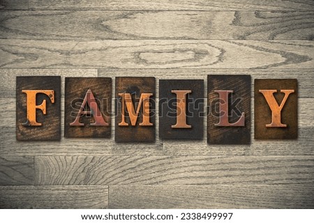 The word -FAMILY- written in wooden letterpress type.