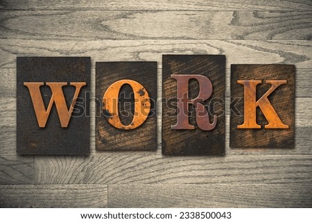 The word -WORK- written in wooden letterpress type.