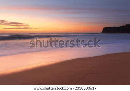 Stunning sunrise at Bungan Beach on Sydney-s northern beaches with views southward toward Mona Vale headland