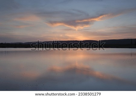 Sunset views across Duralia Lake to Blue Mountains, Penrith