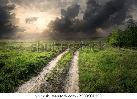 Lightning and storm clouds over country road