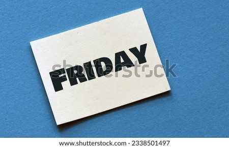 The word FRIDAY on a yellow piece of paper.