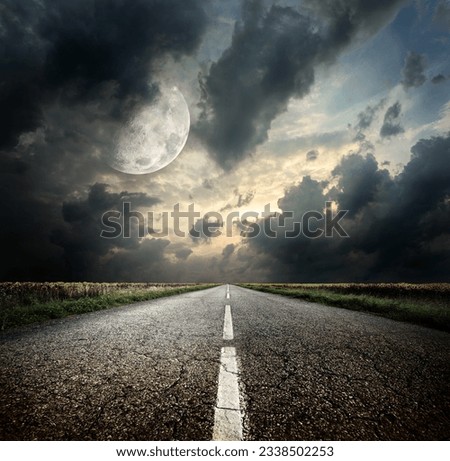 Highway and the moon. Elements of this image furnished by NASA