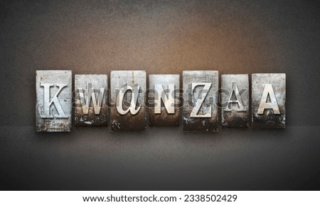 The word KWANZAA written in vintage letterpress type