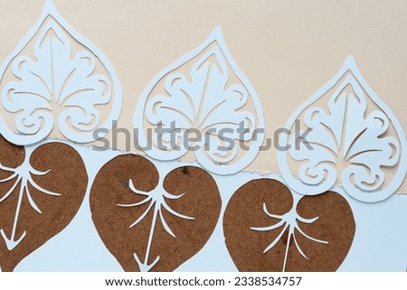 decorative paper palmettes cutouts and stencil on blank paper Royalty-Free Stock Photo #2338534757