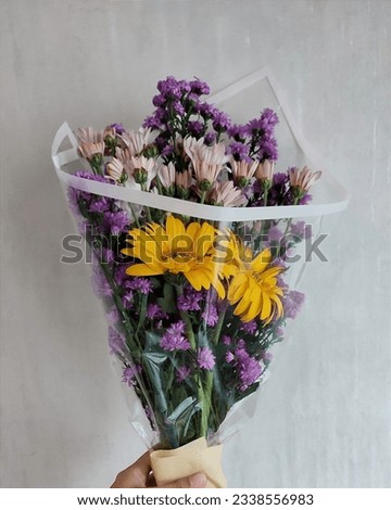 colorful flowers bouquet arrangement with transparant plastic wrapping