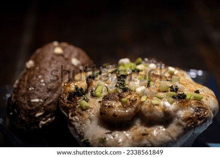 Au gratin served in a patty pan squash with bread. Royalty-Free Stock Photo #2338561849
