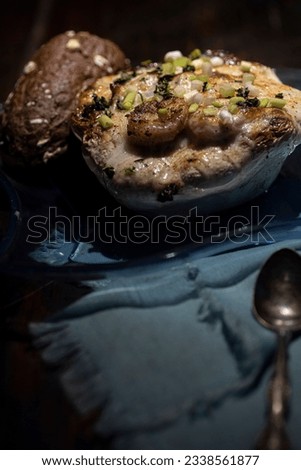 Au gratin served in a patty pan squash with bread. Royalty-Free Stock Photo #2338561877