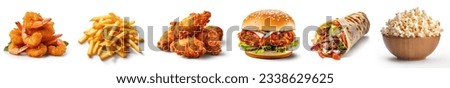Fast food set. fried prawns, French fries, fried chicken, fried chicken burger, shawarma, popcorn bowl. Closeup of fast foods or junk foods. 