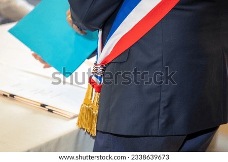 French Mayor scarf red blue white ribbon Royalty-Free Stock Photo #2338639673