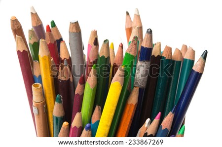 Many used colored pencils isolated on white