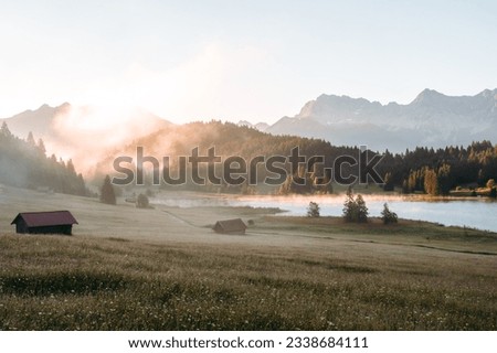 Amazing foggy Sunrise at Geroldsee, also Wagenbruchsee, Bavaria, Germany Europe Royalty-Free Stock Photo #2338684111