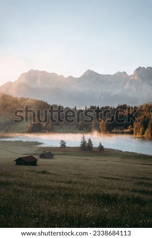 Amazing foggy Sunrise at Geroldsee, also Wagenbruchsee, Bavaria, Germany Europe Royalty-Free Stock Photo #2338684113