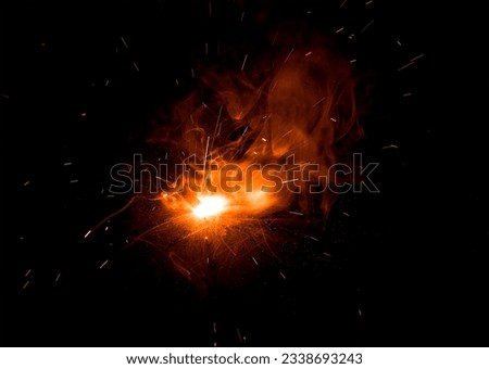 Fire flying sparks with a transparent background Royalty-Free Stock Photo #2338693243