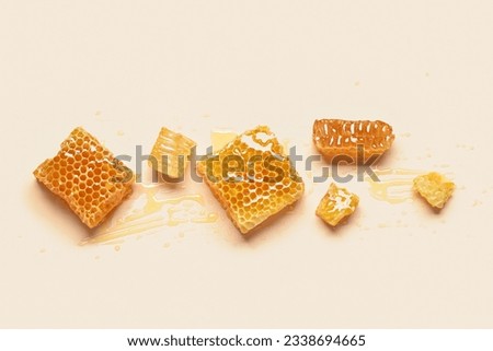 Sweet honeycombs on yellow background Royalty-Free Stock Photo #2338694665