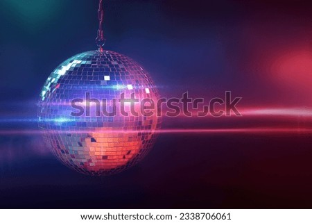 Shiny bright disco ball on dark background Royalty-Free Stock Photo #2338706061