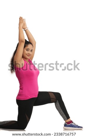 Young indian woman doing exercise,studio shot,fitness girl