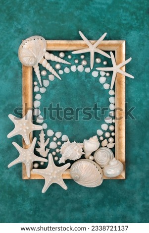 Seashell and pearl abstract border with white shells on mottled turquoise background with gold frame. Nature design with exotic and tropical varieties.