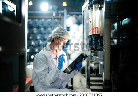 scientist worker checking the quality of Reverse osmosis machine system at the industrial factory. Female worker recording data at the control panel with measure pressure for recycle portable plant. Royalty-Free Stock Photo #2338721367