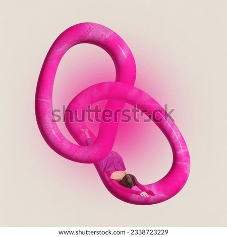 Creative image of young women lies on intarlaced bright pink rings over pastel beige background. Concept of curiosity, imagination, abstract, people and ad.