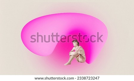 Horizontal picture of upset young woman sitting with knees bent under bright pink figure. Concept of mood, lifestyle, abstract, people and ad.