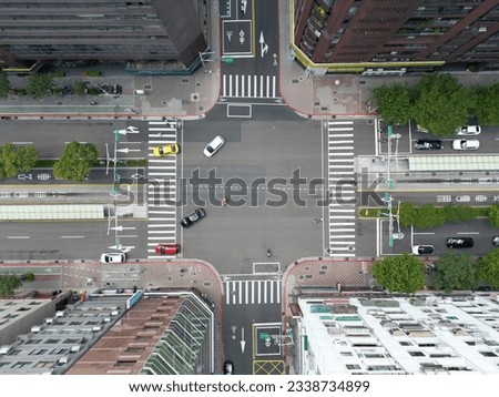 An intersection or an at-grade junction is a junction where two or more roads converge, diverge, meet or cross at the same road. Royalty-Free Stock Photo #2338734899