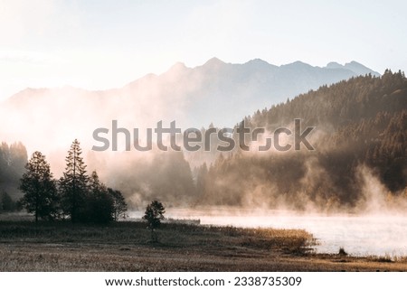 Amazing foggy Sunrise at Geroldsee, also Wagenbruchsee, Bavaria, Germany Europe Royalty-Free Stock Photo #2338735309