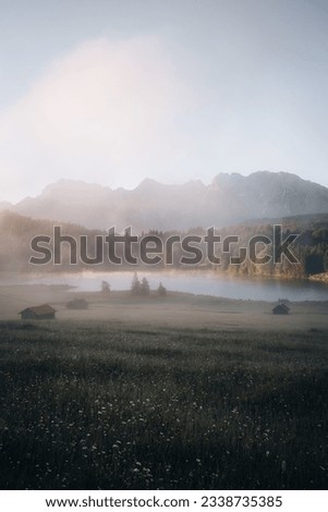 Amazing foggy Sunrise at Geroldsee, also Wagenbruchsee, Bavaria, Germany Europe Royalty-Free Stock Photo #2338735385