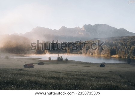 Amazing foggy Sunrise at Geroldsee, also Wagenbruchsee, Bavaria, Germany Europe Royalty-Free Stock Photo #2338735399