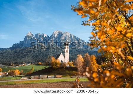 Bright photo of St. Constantine church in Dolomites, Trentino Alto Adige Italy Royalty-Free Stock Photo #2338735475