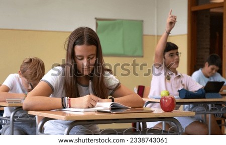 Teenagers in a high school classroom. Back to school concept