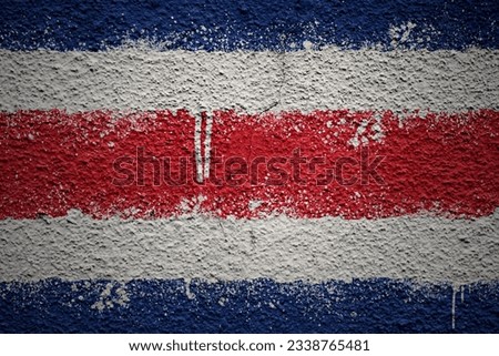 colorful painted big national flag of costa rica on a massive old cracked wall