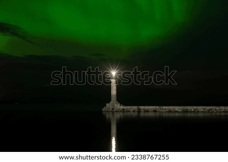Northern lights (Aurora Borealis), Finnish lighthouse Vuohensalo, summer night, Motornaya bay, Priozersk, Ladoga lake, Russia