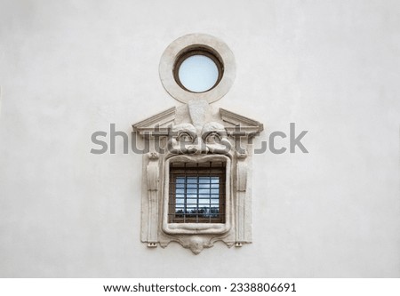Detail of window in Mannerist Reinaissance style fasade. Palazzo Zuccari, Italy. Concept of travel, tourism and vacation in city.