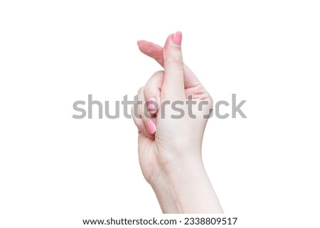 Asian woman make her hand like mini heart shape Korea style as a sign of love isolated on white background.