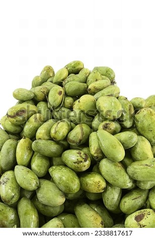 a photography of a pile of green beans on a white surface, a close up of a pile of green beans on a white surface.