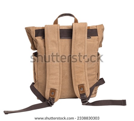 Vintage canvas backpack with leather handles isolated on white background