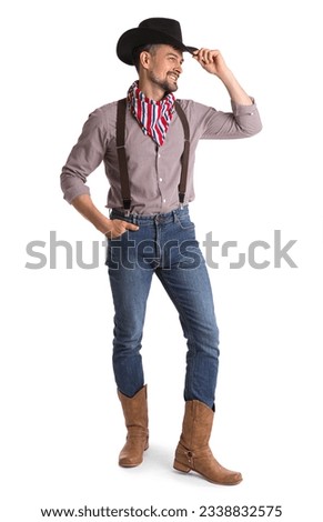 Handsome cowboy on white background Royalty-Free Stock Photo #2338832575