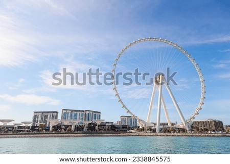 View of Ain Dubai ferris wheel and city skyline from Jumeirah Beach, Dubai, UAE Royalty-Free Stock Photo #2338845575