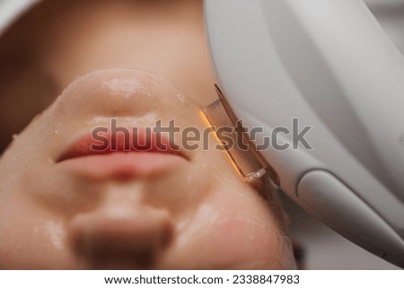 Phototherapy, photorejuvenation, IPL in a beauty salon. Care for a woman's face. High quality photo Royalty-Free Stock Photo #2338847983