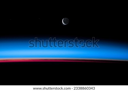 Planet earth horizon and the crescent moon in the black background, blue world photo, Lunar Views and Beyond, sattelite photo, outer space image. Elements of this image furnished by NASA.