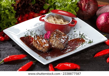 roasts to the wood sauce with pasta, filé mignon steak Royalty-Free Stock Photo #2338877587