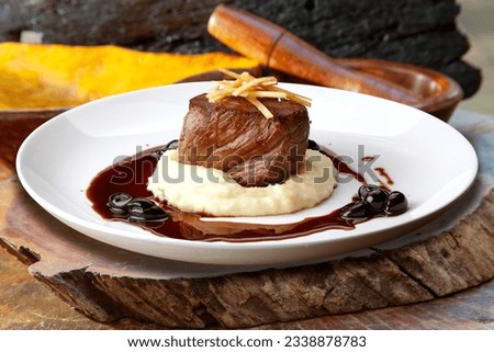 Filet mignon with mashed food Royalty-Free Stock Photo #2338878783