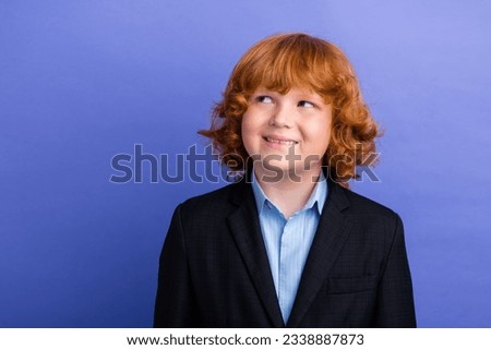 Photo of minded cheerful creative person beaming smile look empty space brainstorming isolated on violet color background