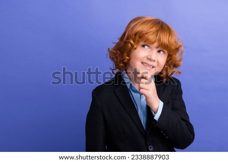Photo of creative clever positive boy toothy smile hand touch chin look empty space isolated on violet color background