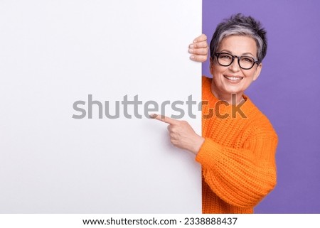 Photo of shiny pretty lady wear knitted pullover spectacles pointing poster empty space isolated purple color background