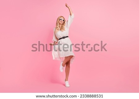 Full size photo of attractive blonde woman dancing discotheque sunglass wear trendy white clothes isolated on pink color background